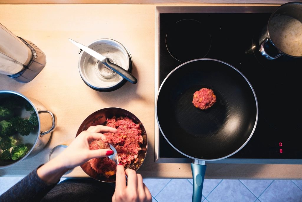 A cook working at the open kitchen