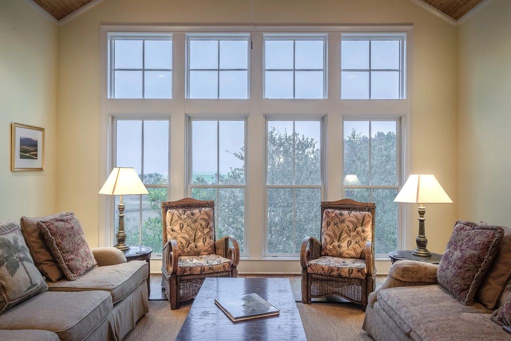 A suite sitting room with a sofa and armchairs
